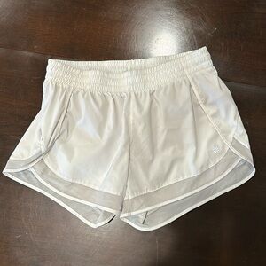 Athleta white mesh racer run 4 inch shorts, size medium